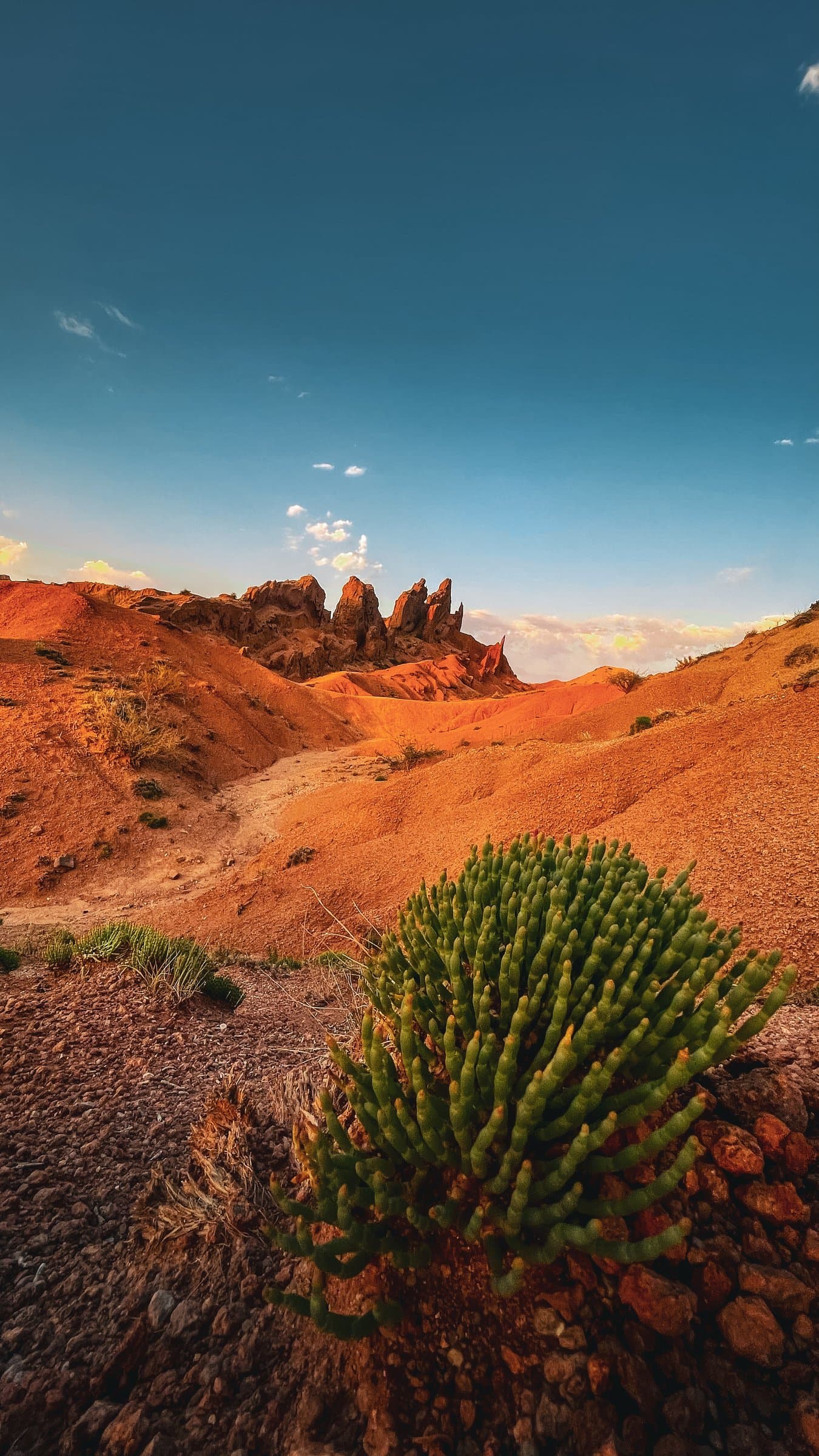 Eroded red sandstone rock formations at Jeti-Oguz